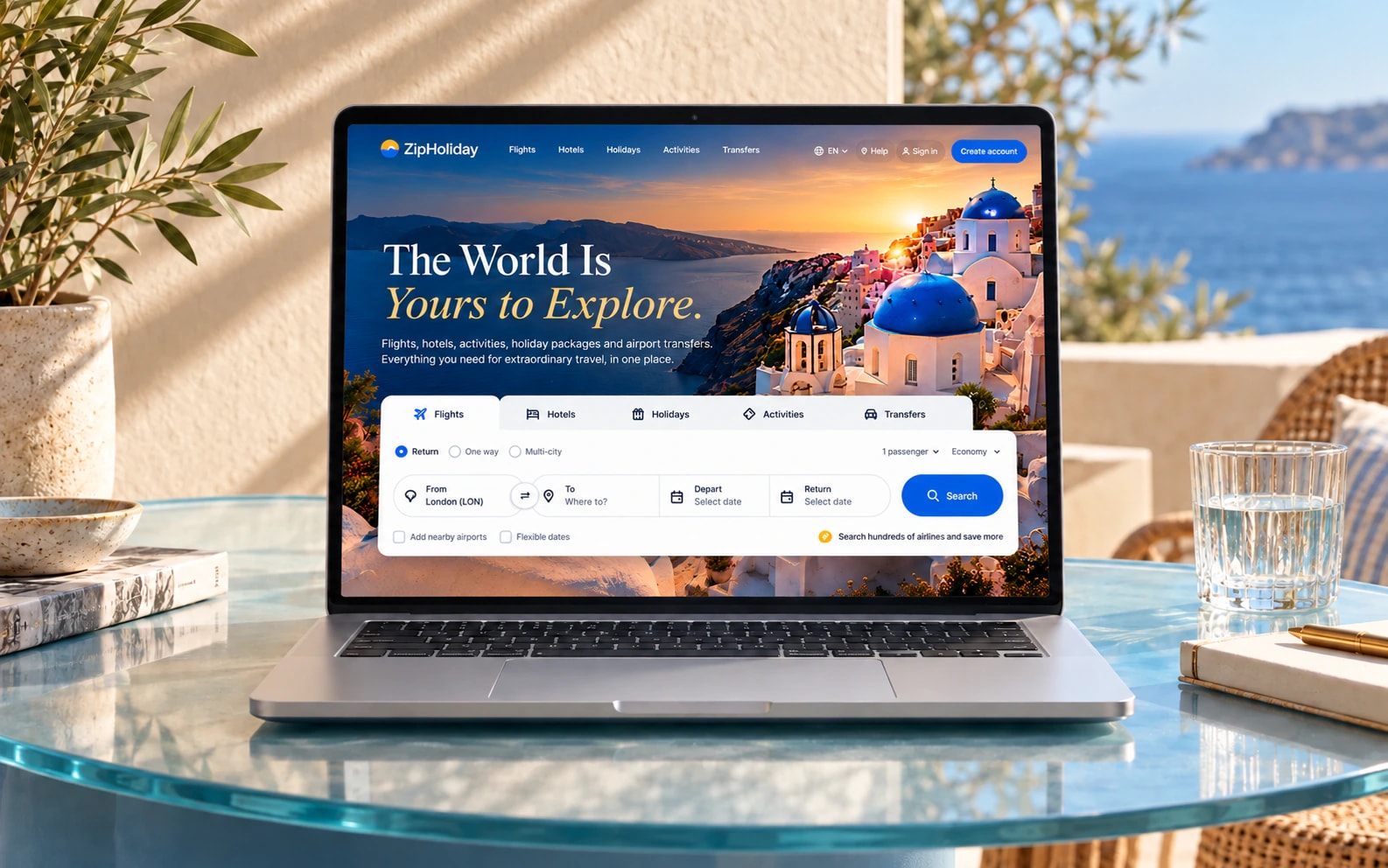 Zip Holiday’s updated Santorini travel-booking hero displayed on a silver laptop on a sunlit Mediterranean terrace.